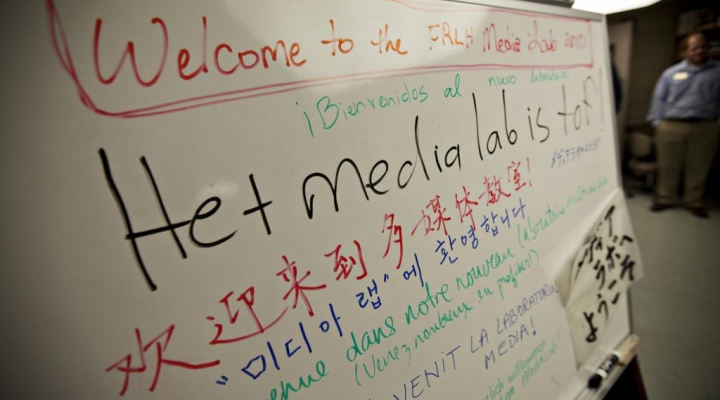 White board displays welcoming messages in multiple languages